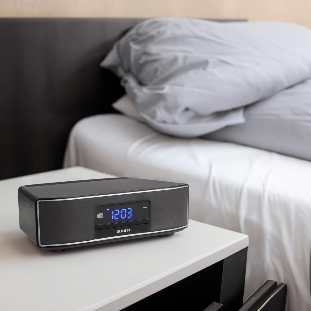 AIWA sistema en sala de estar con decoración, integración estética y sonora
