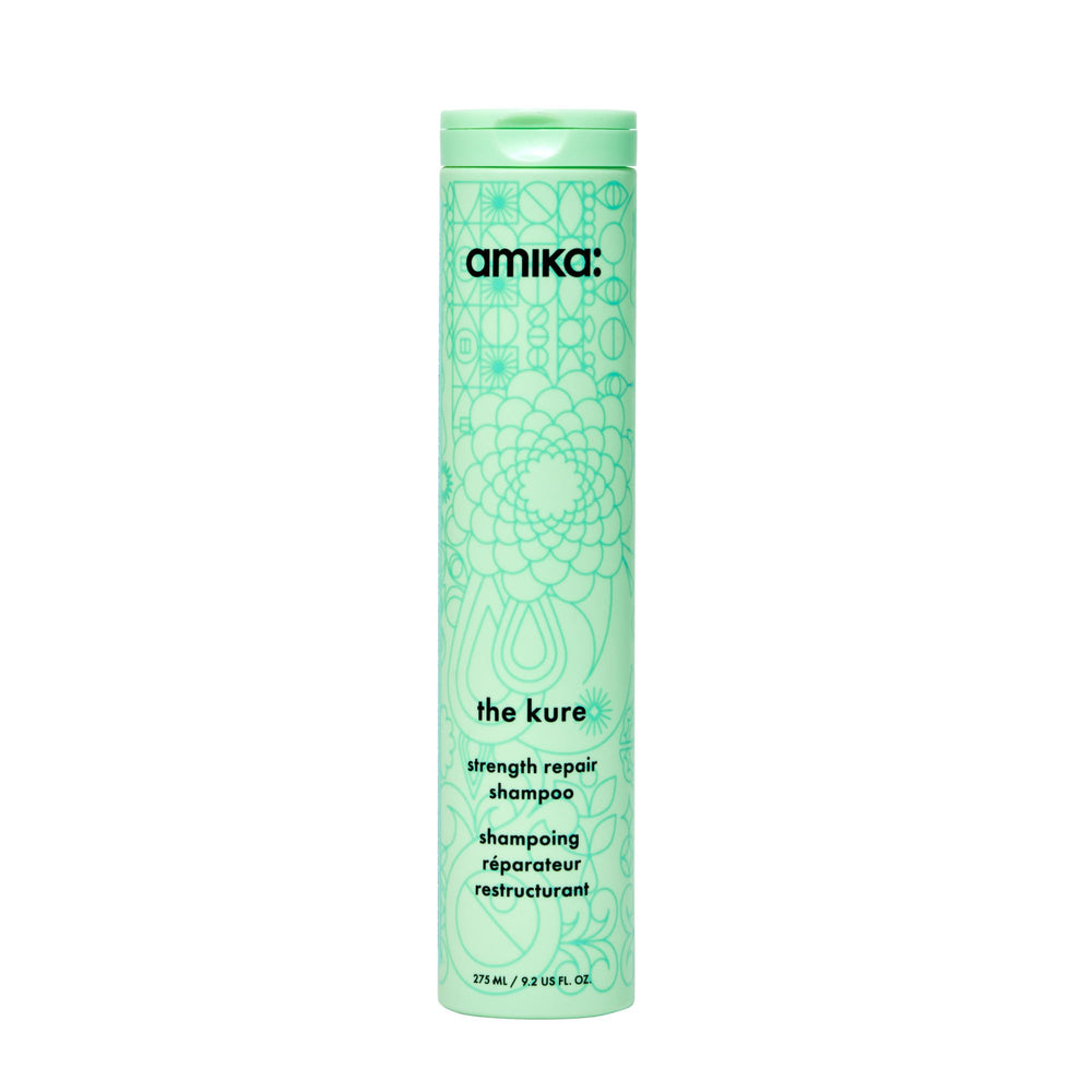Amika botella frontal 275 ml mostrando diseño y volumen para cuidado reparador