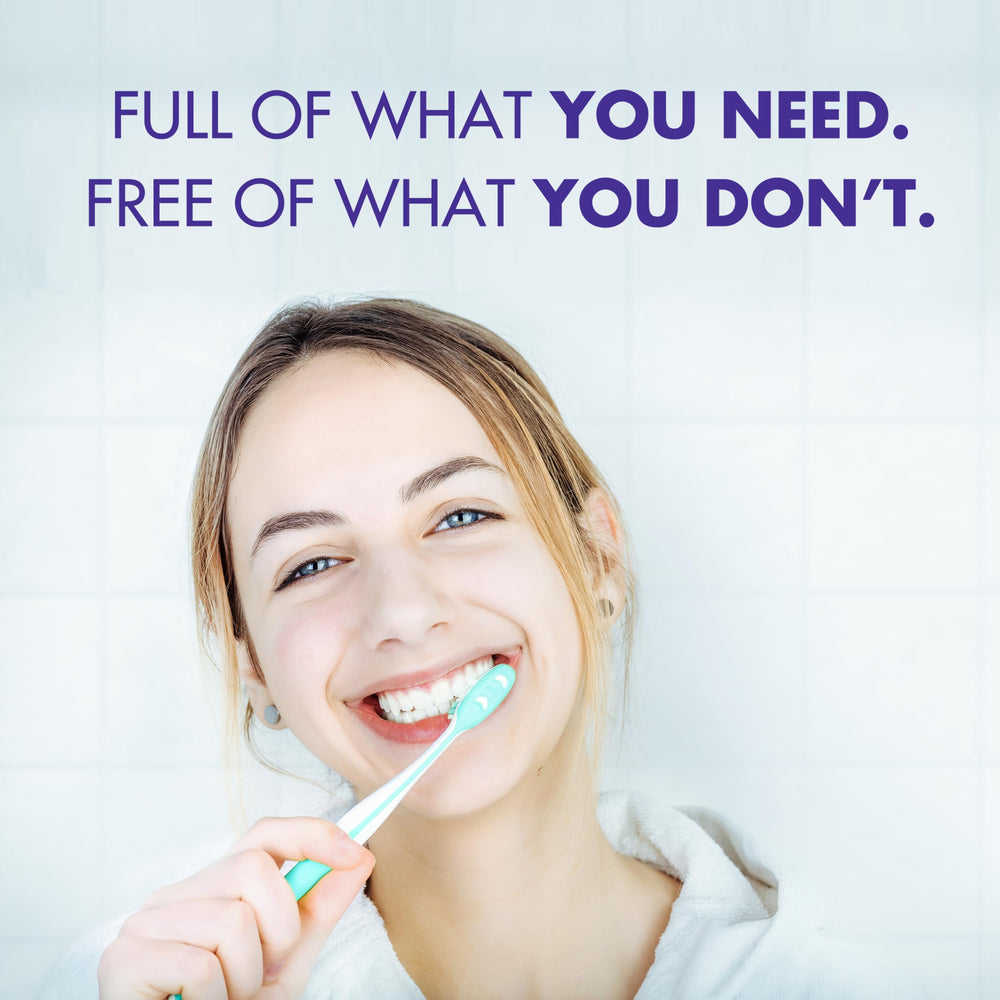 Arm & Hammer tubo sostenido en mano, muestra tamaño real portátil