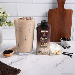 Atkins shake poured into glass demonstrating creamy texture