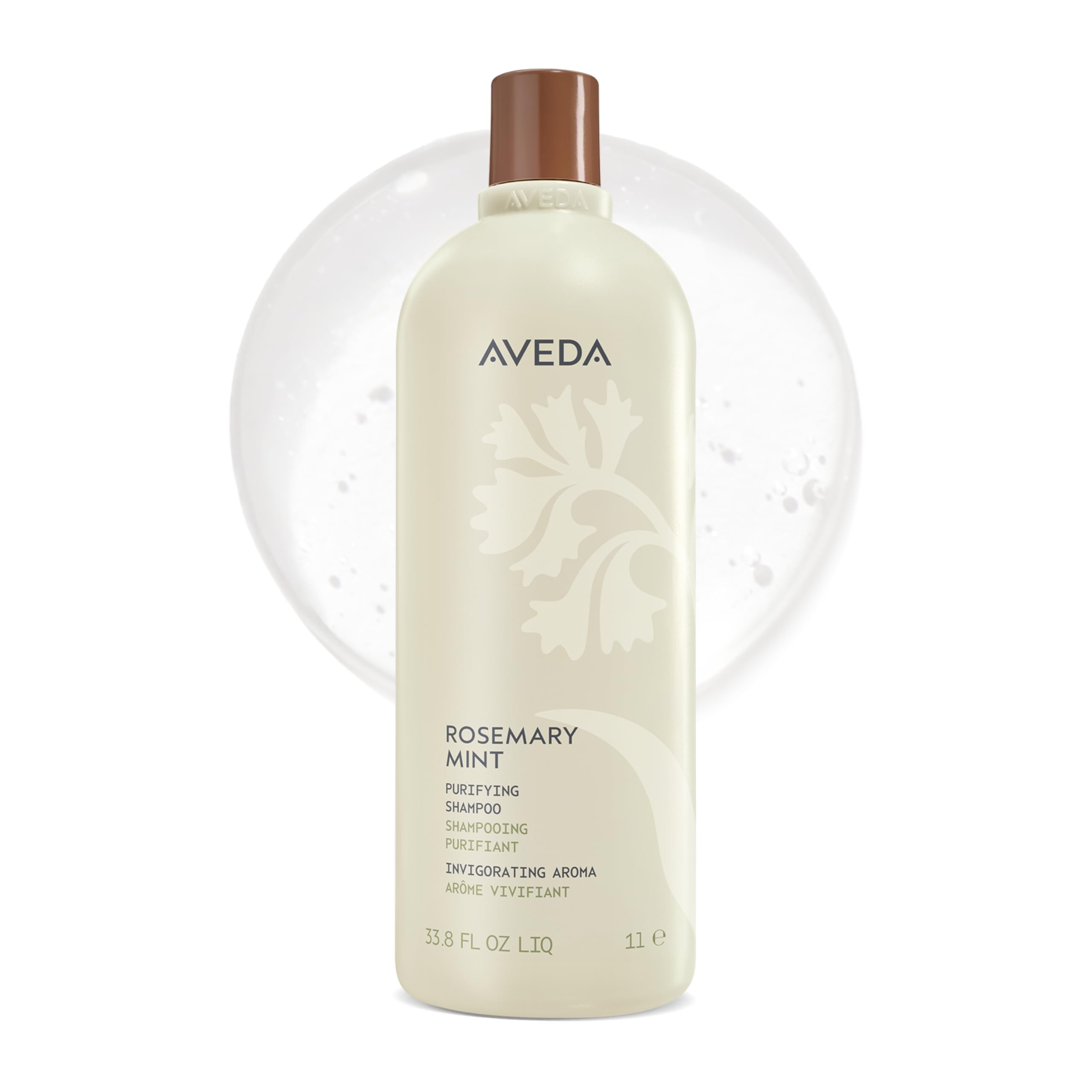 Aveda botella frontal grande mostrando fórmula purificante y beneficio de limpieza