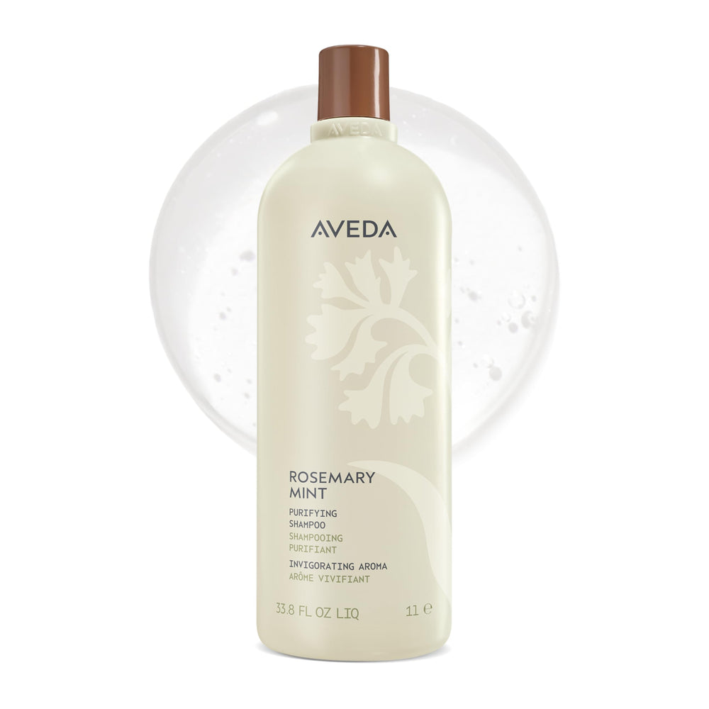 Aveda botella frontal grande mostrando fórmula purificante y beneficio de limpieza