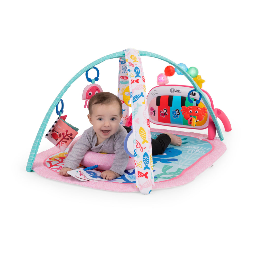 Baby Einstein bebé en tummy time usando la almohadilla de soporte, fortalece cuello