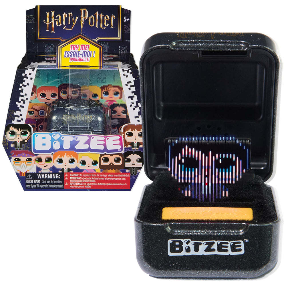 BITZEE cápsula frontal negra y dorada mostrando diseño Hogwarts y atractivo visual