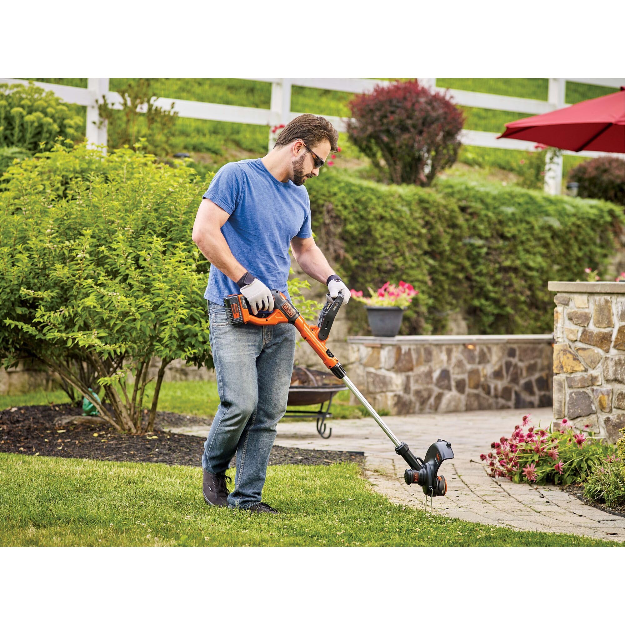 BLACK+DECKER scale comparison placed next to tool showing compact 13-inch cutting width