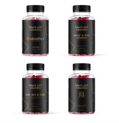 Black Girl Vitamins empaque frontal mostrando el bundle para uso diario