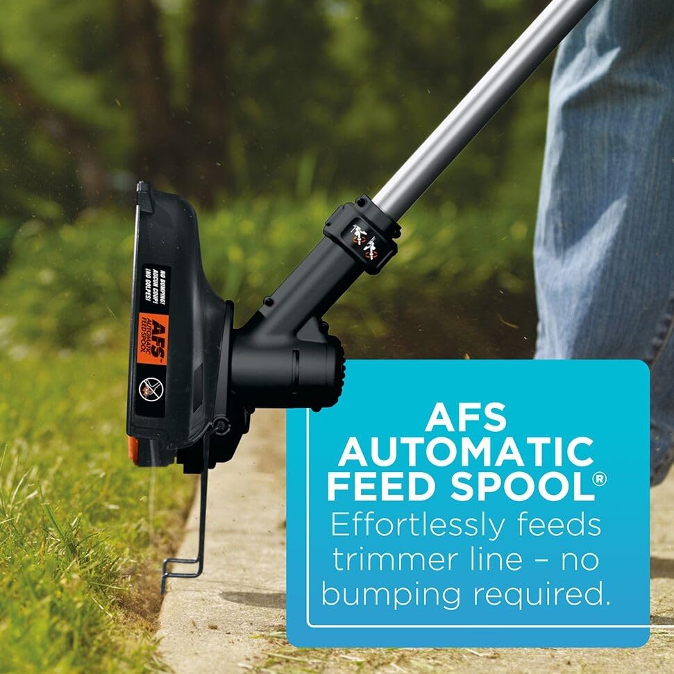 BLACK+DECKER trimmer being used in lawn demonstrating efficient cutting and maneuverability