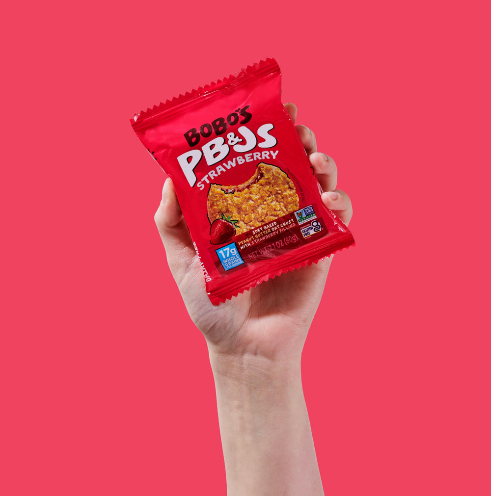 Bobo's barras en lonchera escolar entre frutas, opción saludable para niños
