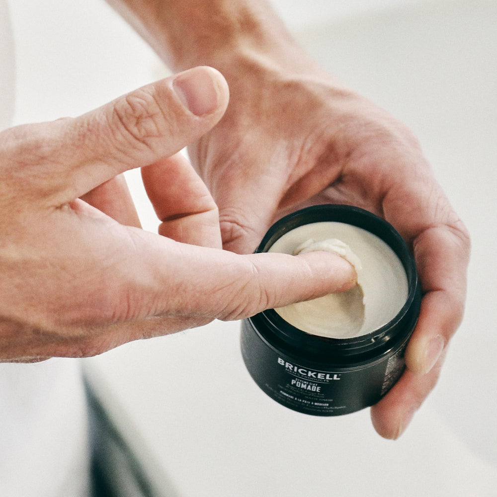Brickell Men's Products displayed on a bathroom shelf suggesting daily grooming routine