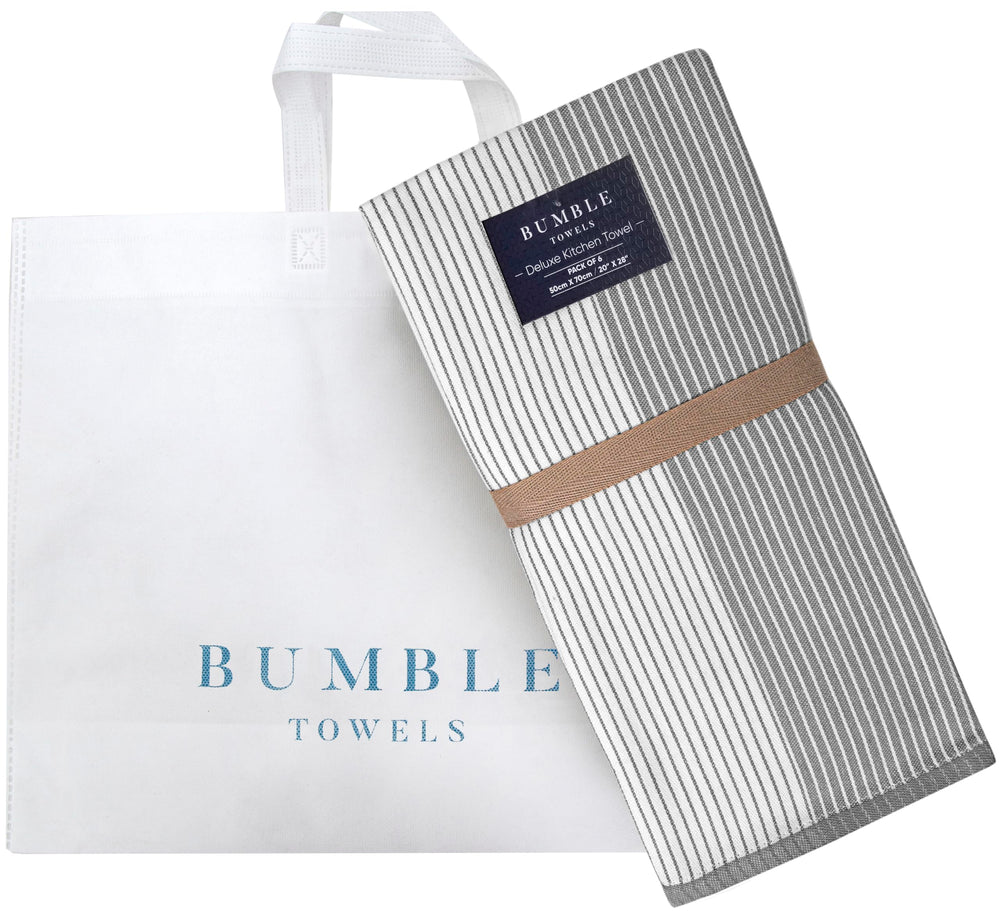 Bumble Towels comparación de tamaño con plato mostrando dimensiones prácticas