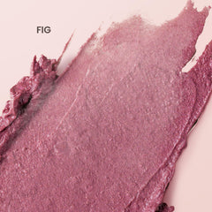 Burt's Bees swatch en brazo que muestra tono rosa-higo construible