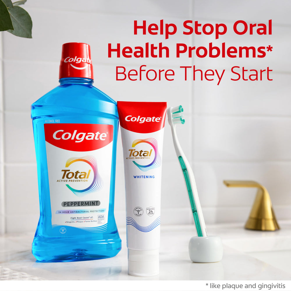 Colgate Total botella 500 ml junto a una regla para escala