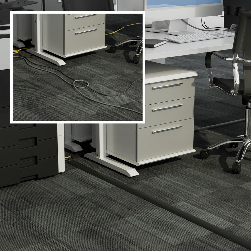D-Line cubrecables en oficina cubriendo extensiones, evitando tropiezos