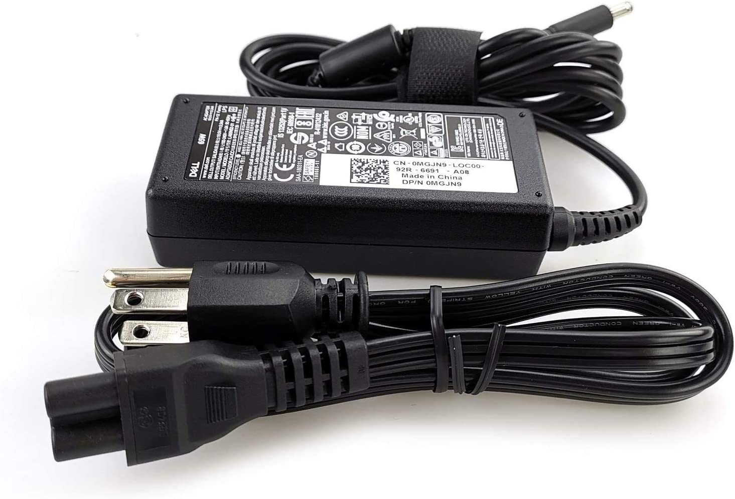 Dell charger label and specs closeup confirming 65W output and compatibility