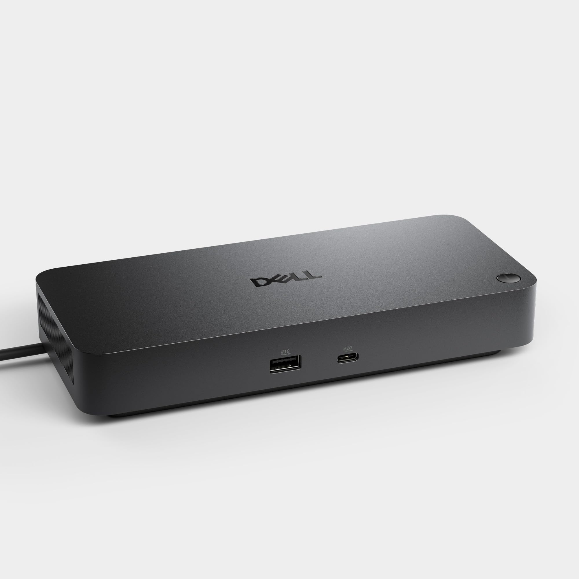 Dell WD25 comparación de tamaño junto a laptop para escala y facilidad de uso