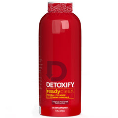 Detoxify botella frontal Tropical 16 oz mostrando diseño y tamaño práctico