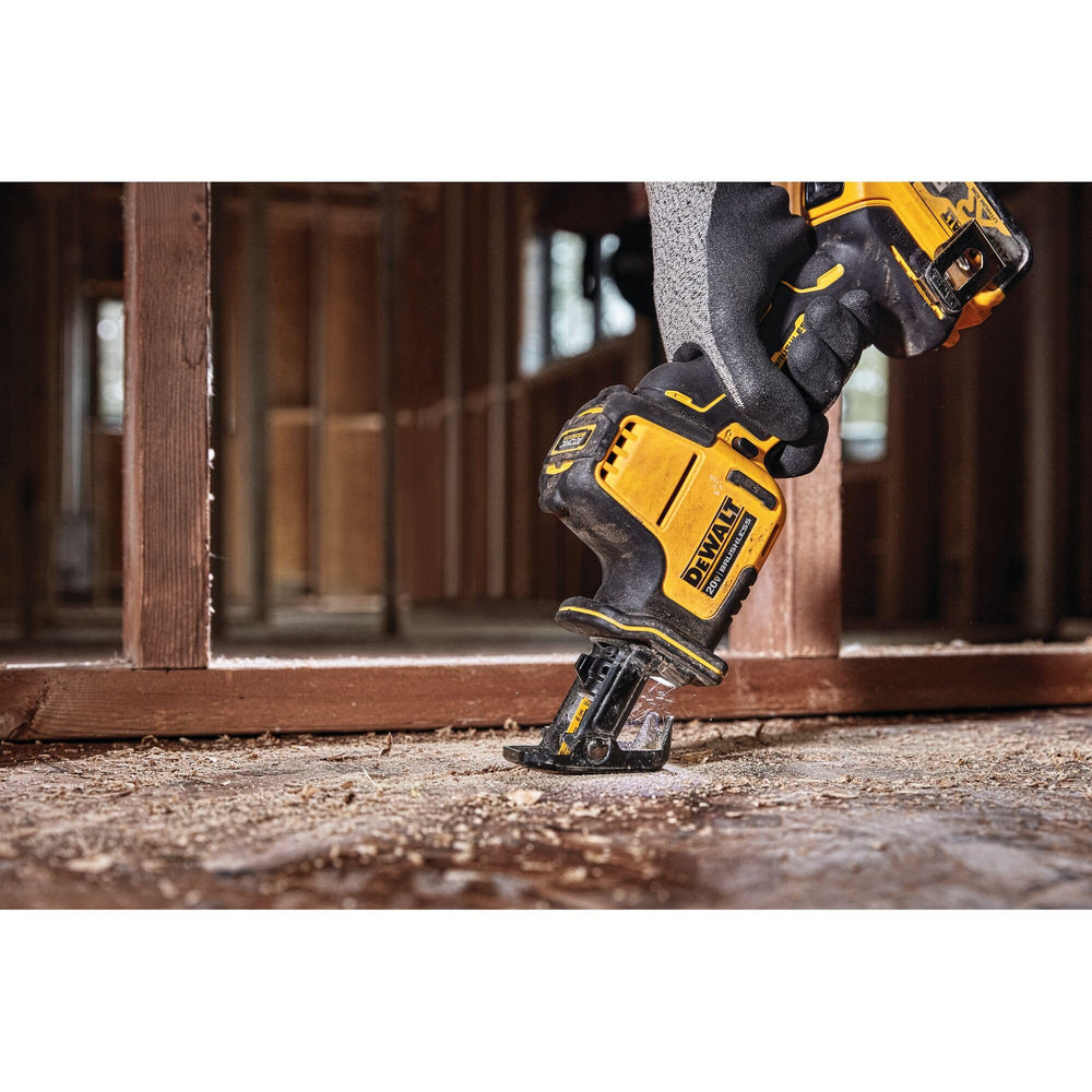 DEWALT saw next to hand shows 12.5-inch compact size benefit
