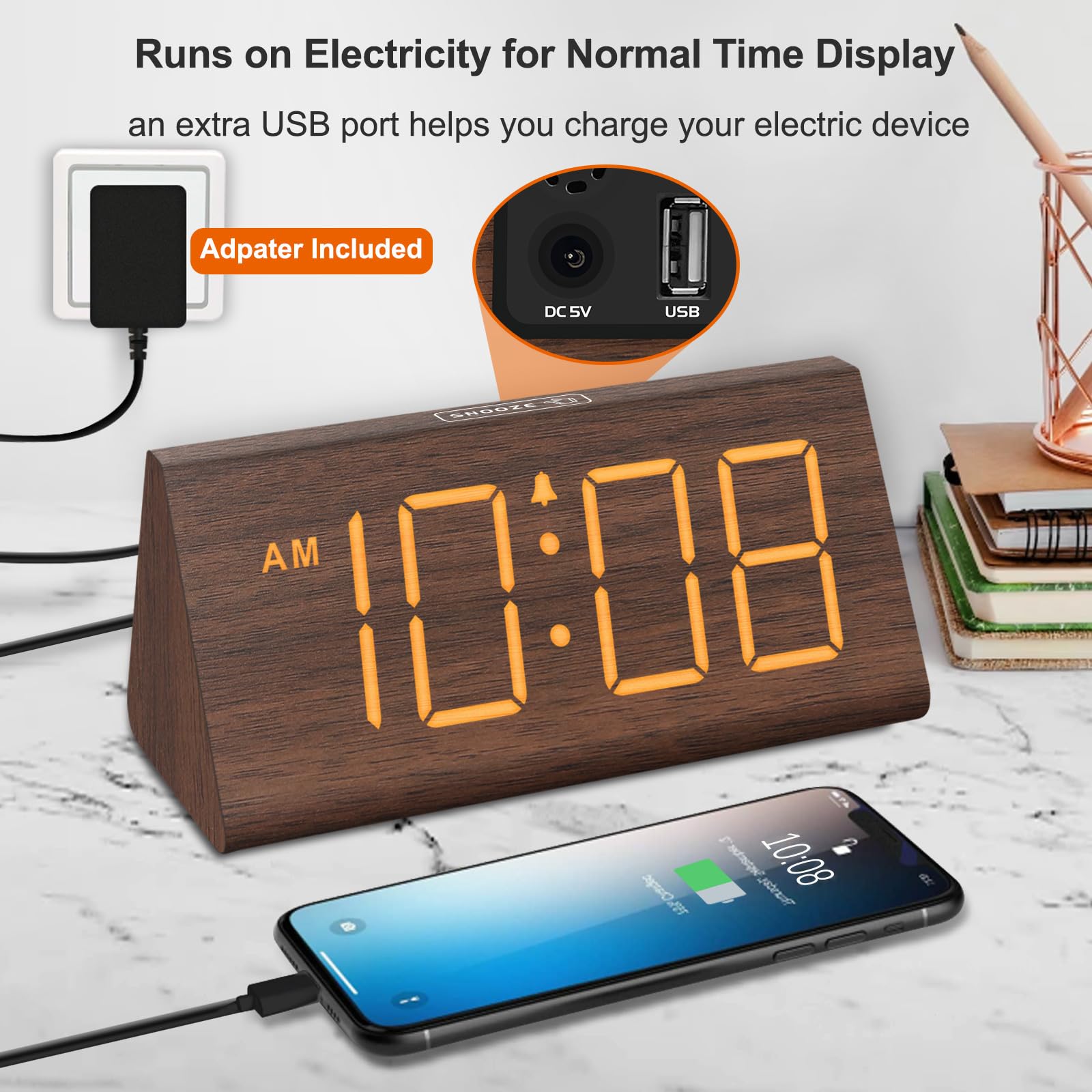DreamSky reloj junto a libro para comparar tamaño compacto
