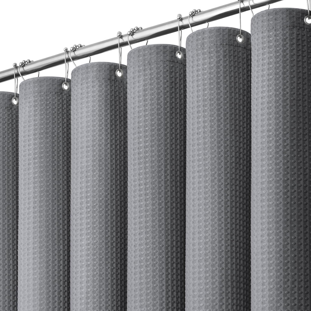Dynamene vista frontal de cortina waffle gris con caída elegante