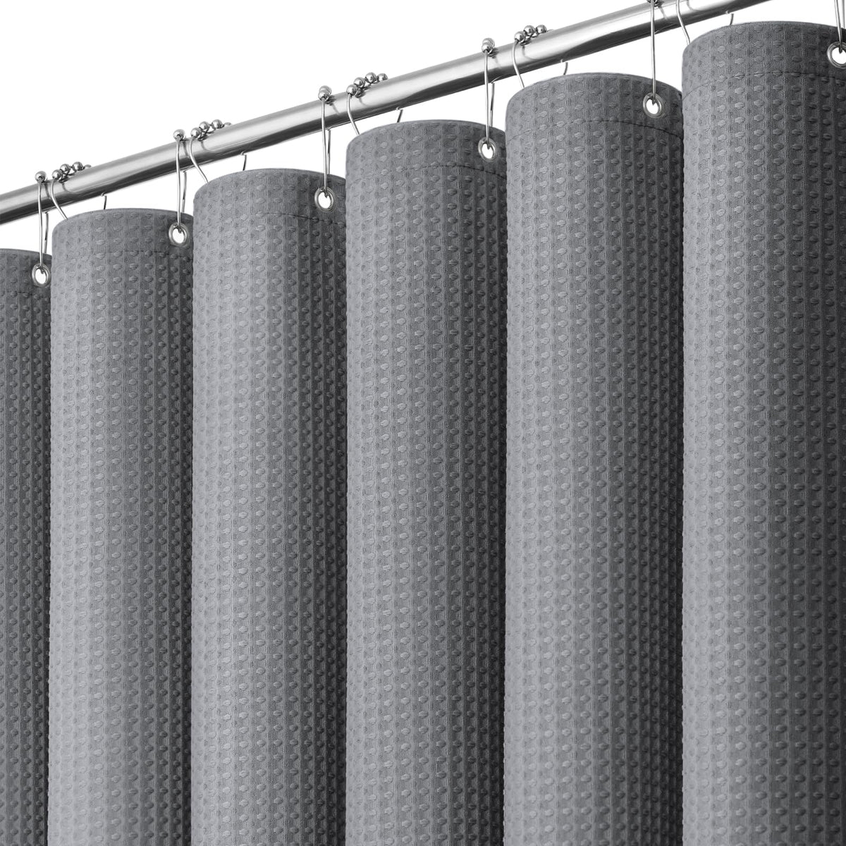Dynamene vista frontal de cortina waffle gris con caída elegante