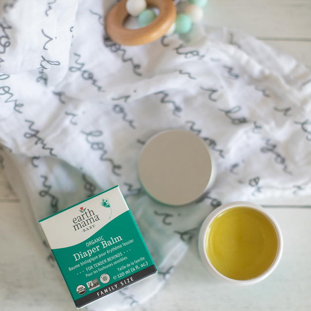Earth Mama jar on nursery shelf conveying natural baby care routine