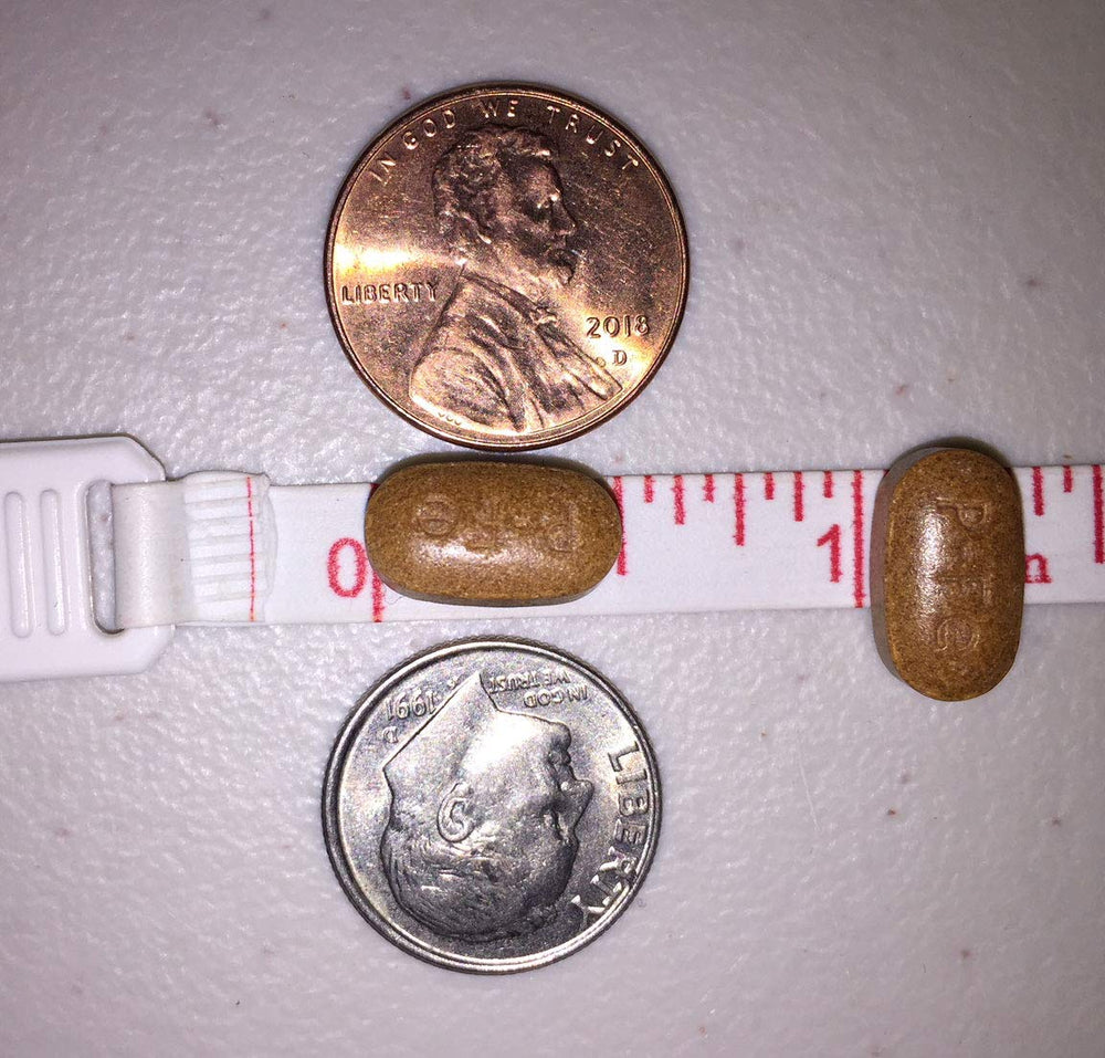 Ferretts botella abierta con comprimidos mostrando el contenido práctico