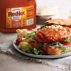 Frank's RedHot asa del envase que facilita transporte seguro en cocina