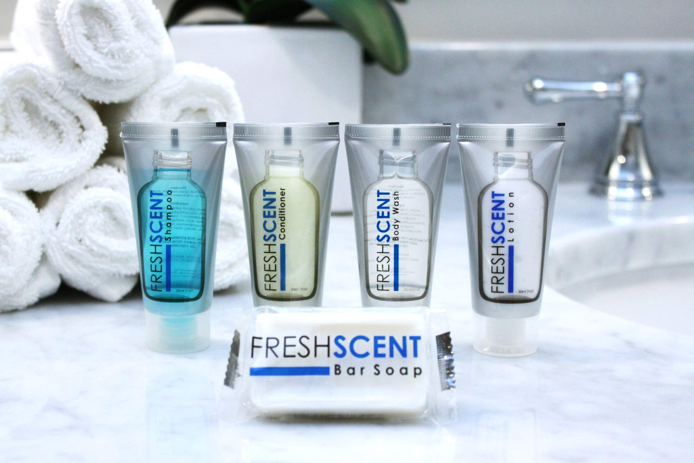 Freshscent comparación de tamaño con monedas resaltando formato viaje
