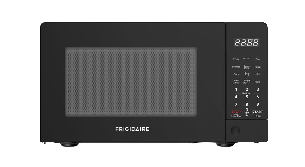 Frigidaire microondas vista frontal mostrando tamaño compacto y diseño elegante