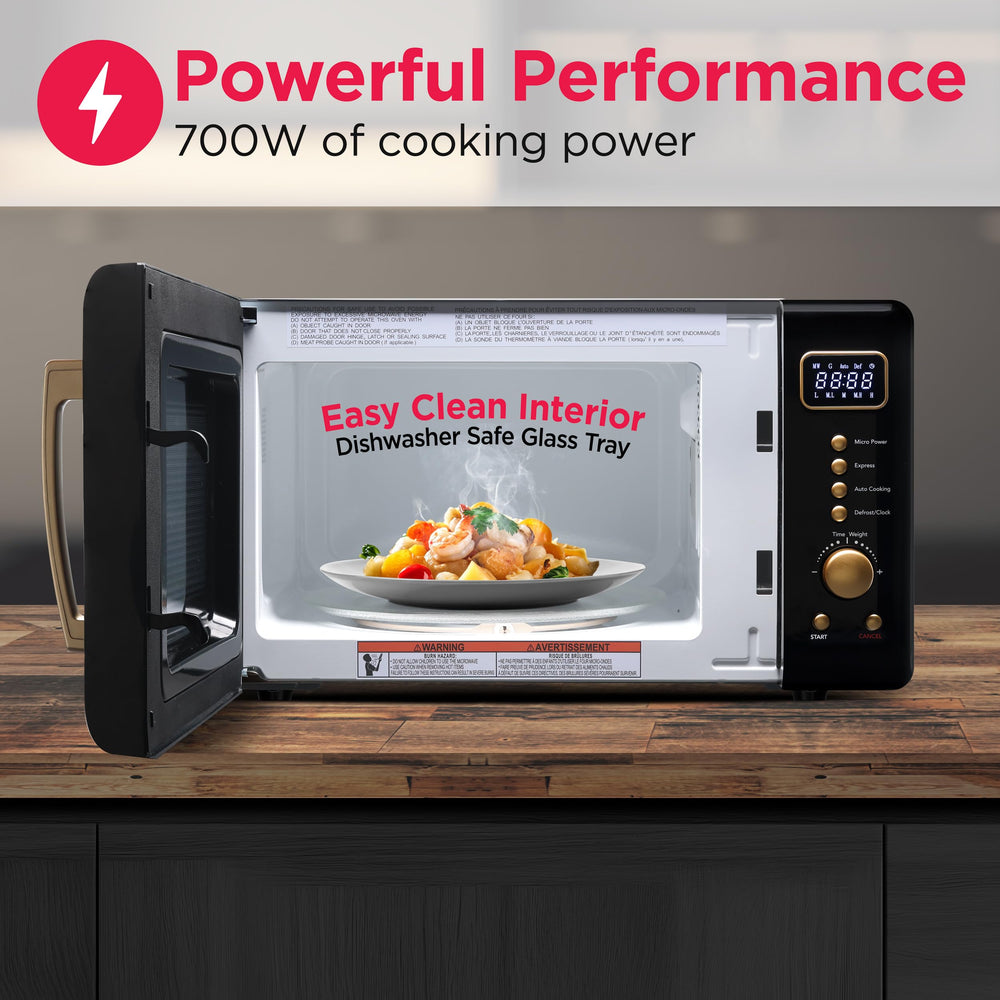 Frigidaire EMW788 junto a objetos para comparar tamaño, muestra su formato compacto