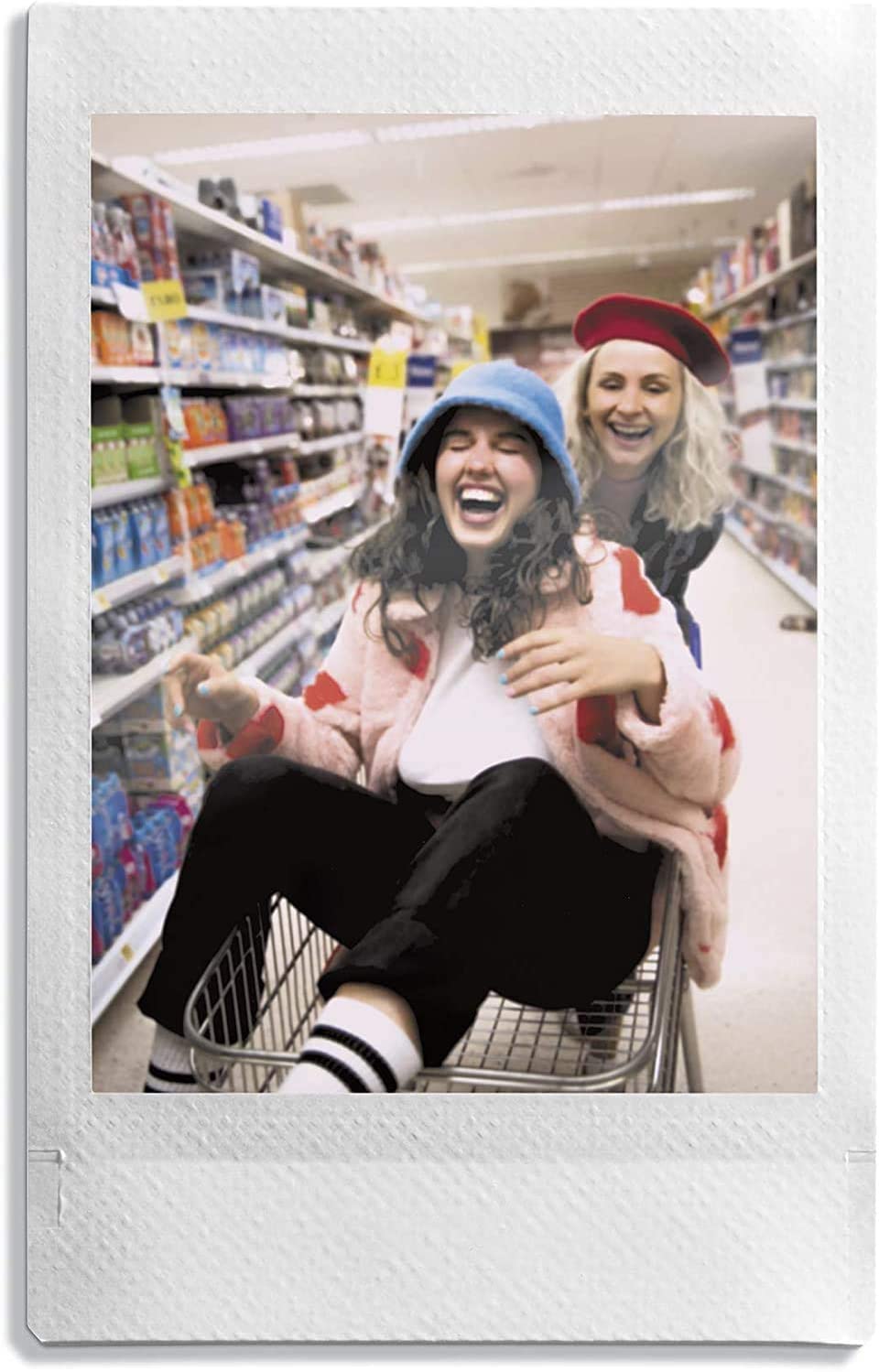 Fujifilm: película saliendo de cámara Instax Mini, revela fotos rápidamente