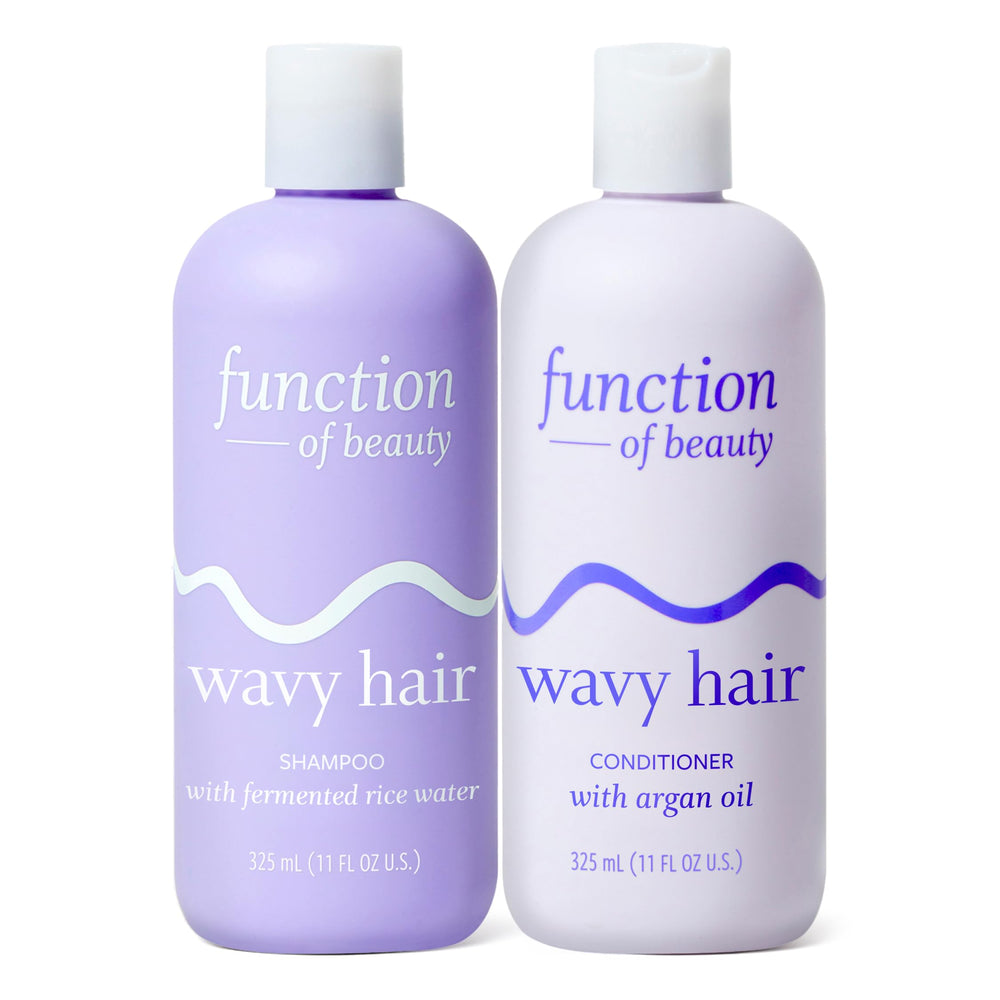 Function of Beauty set frontal mostrando botellas y beneficio antifrizz