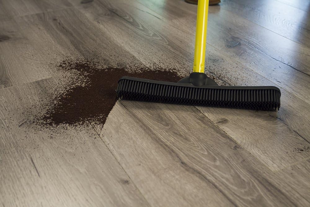 FURemover cleaning liquid on hardwood floor demonstrating spill removal without scratching