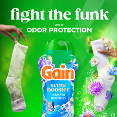 Gain botella junto a regla para comparar tamaño y capacidad de 24 oz