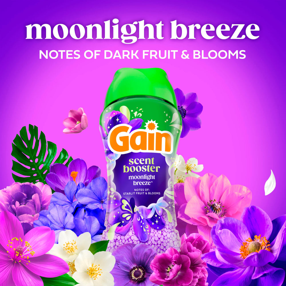 Ropa recién lavada con Gain Moonlight Breeze colgada que sugiere frescura prolongada