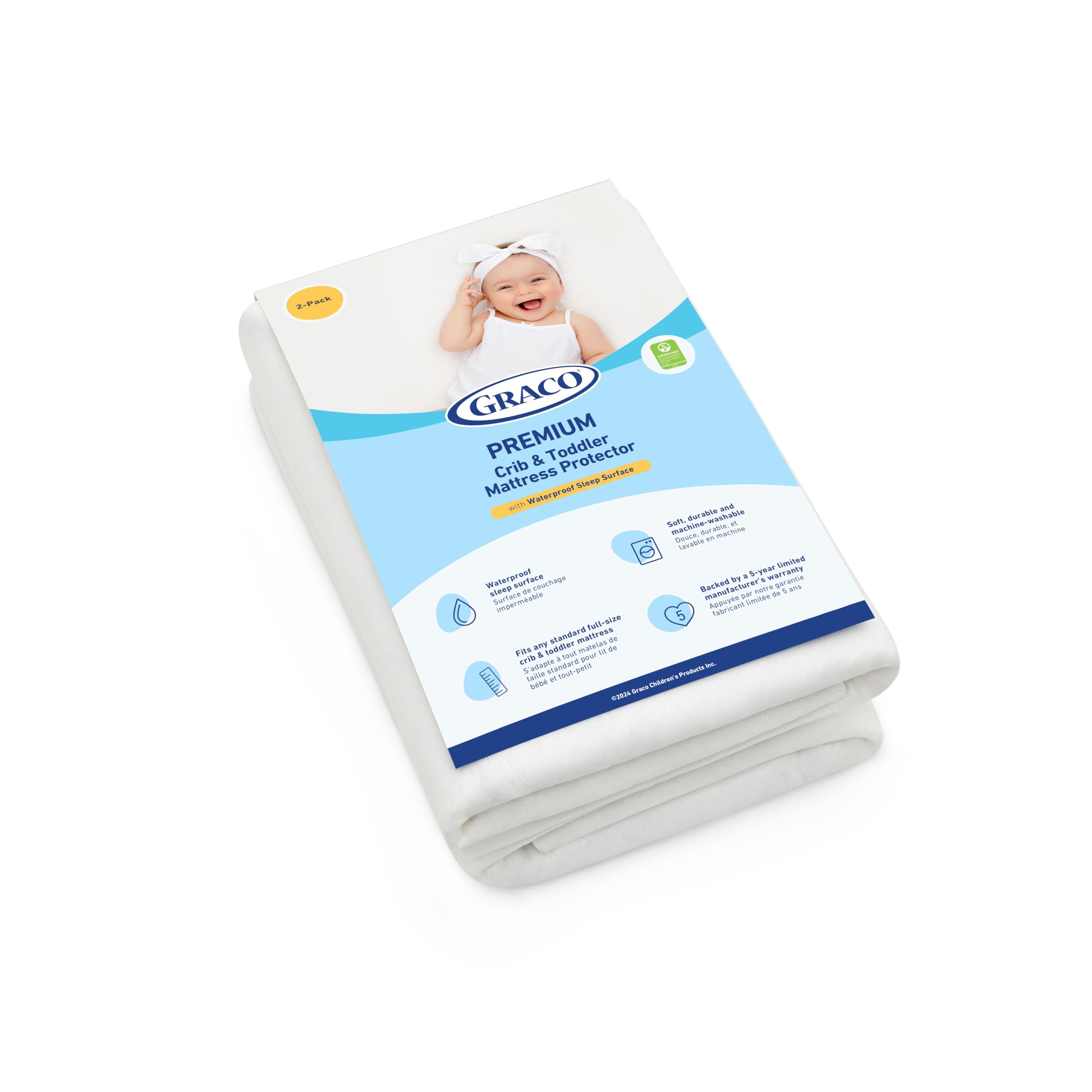 Graco protector en cama toddler mostrando uso diario práctico