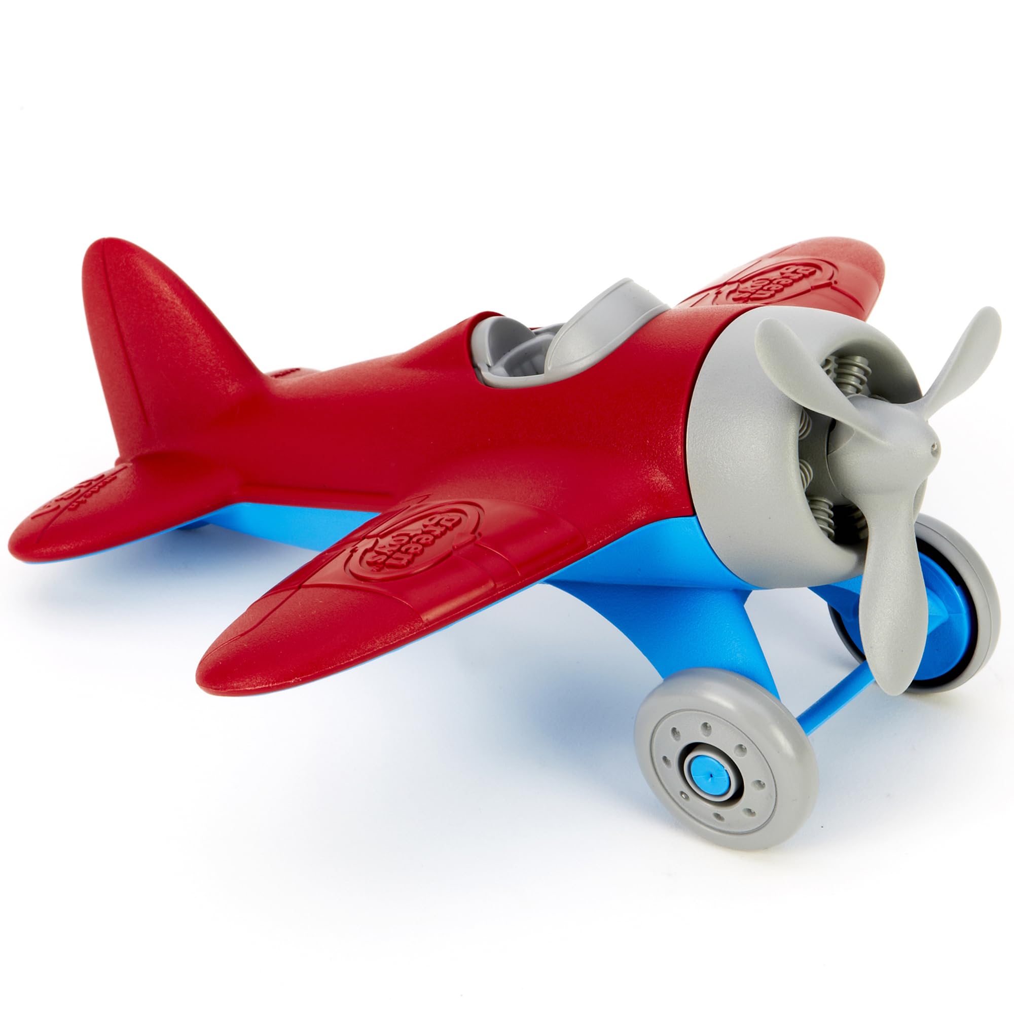 Green Toys avión hélice giratoria destacando manipulación segura