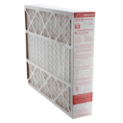 Honeywell Home escala del filtro junto a herramientas para comprobar medidas