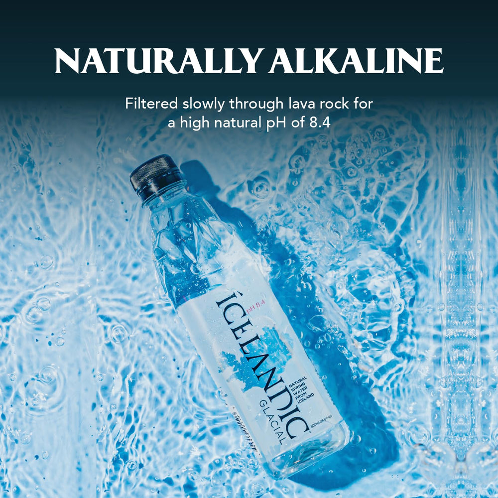 Icelandic Glacial botella sobre mesa junto a platos, armoniza con comidas
