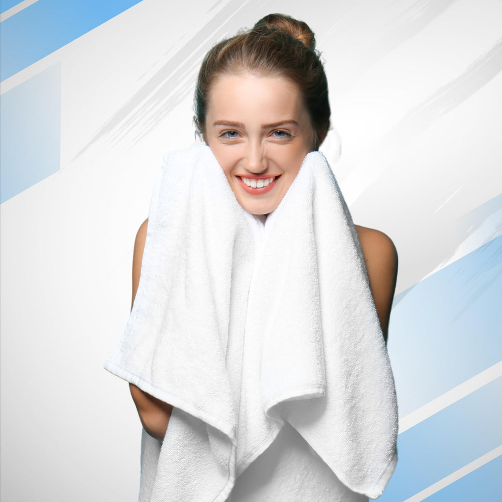Infinitee Xclusives set de toallas en baño ambientado estilo spa