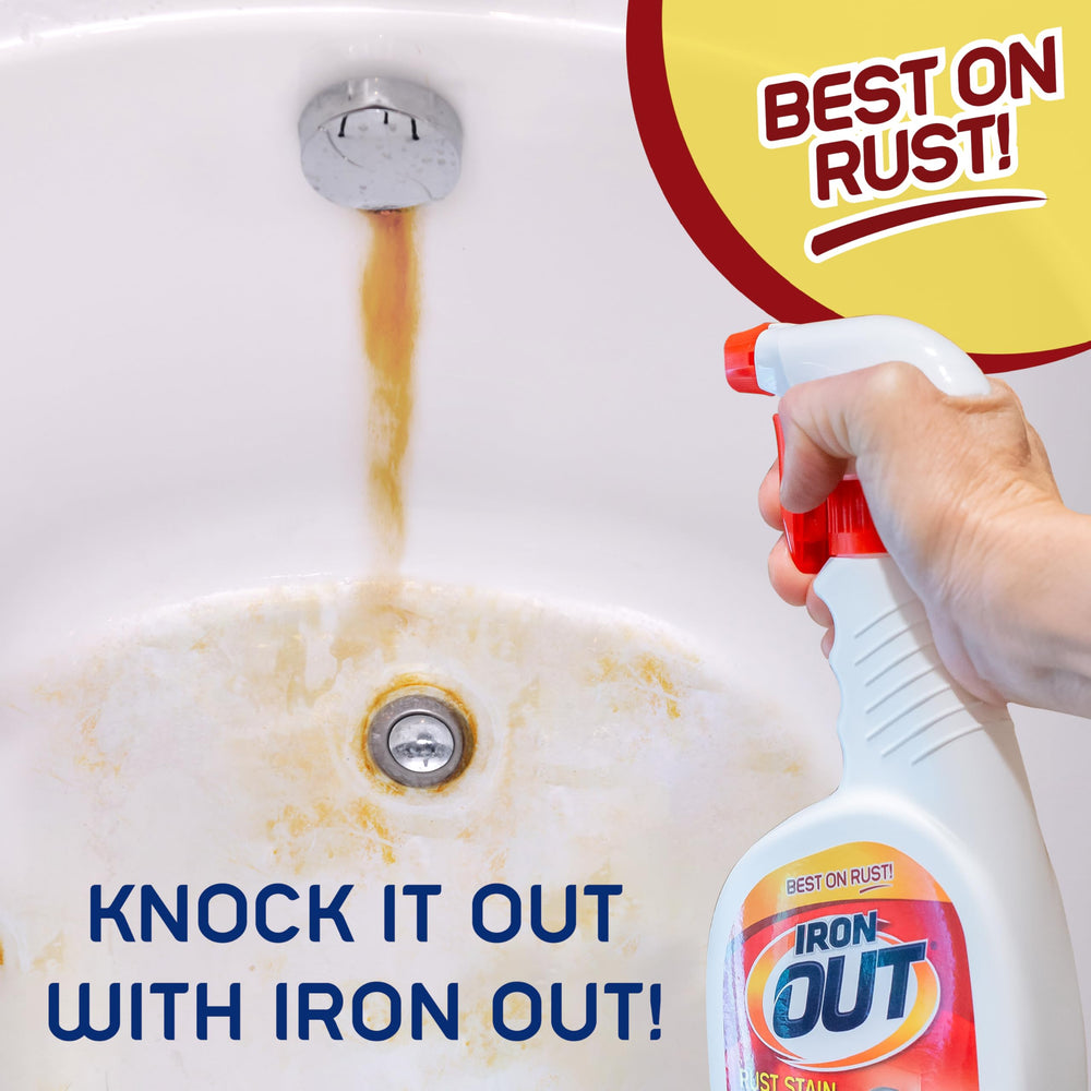 IRON OUT botella 24 oz junto a una mano para mostrar escala y control de aplicación