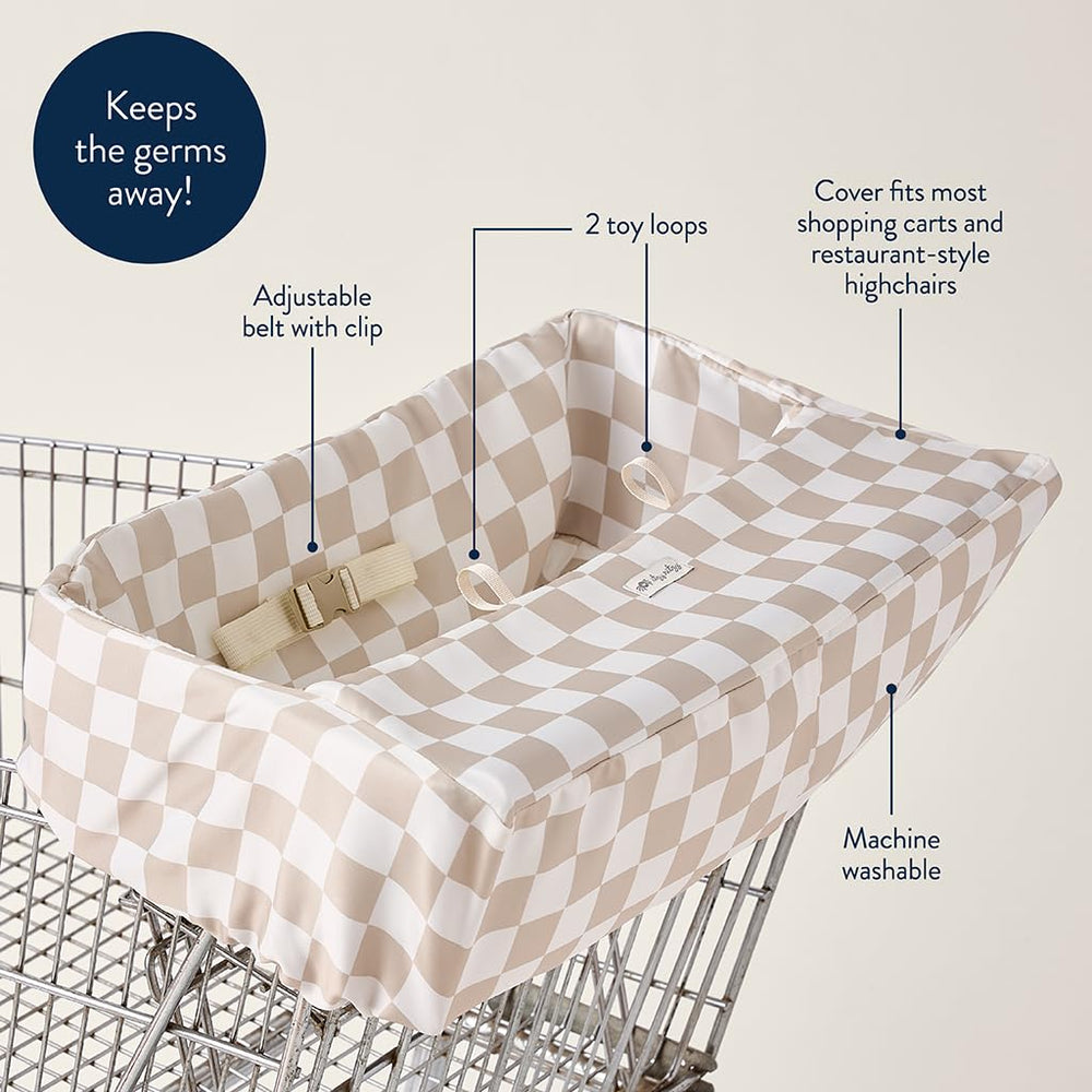 Itzy Ritzy funda colocada en carrito de compras mostrando uso práctico fuera de casa
