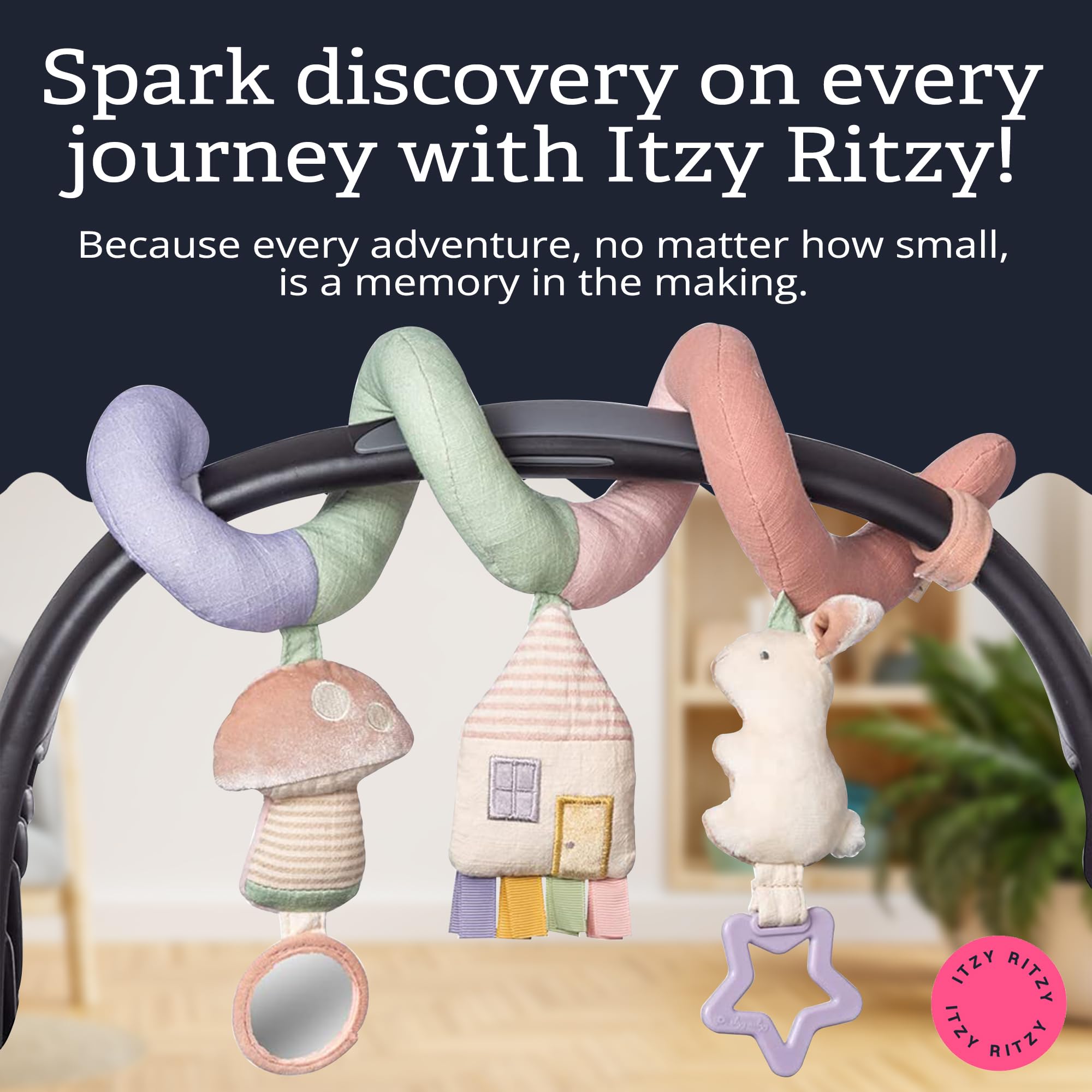 Itzy Ritzy spiral beside adult hand showing compact size and portability