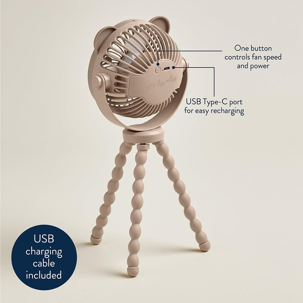 Itzy Ritzy ventilador en mano para comparar tamaño y portabilidad fácil
