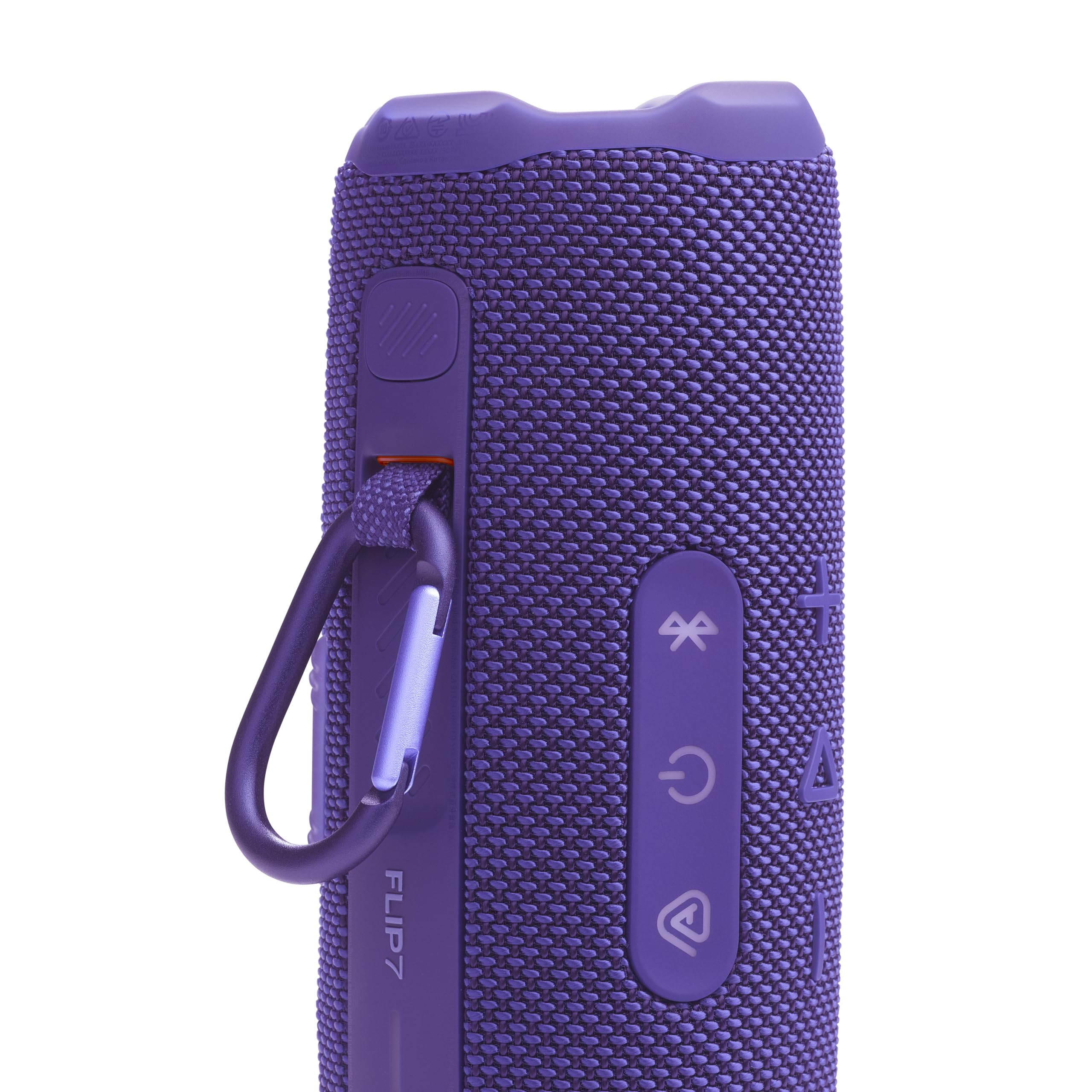 JBL Flip 7 en la playa reproduciendo música sin preocupaciones