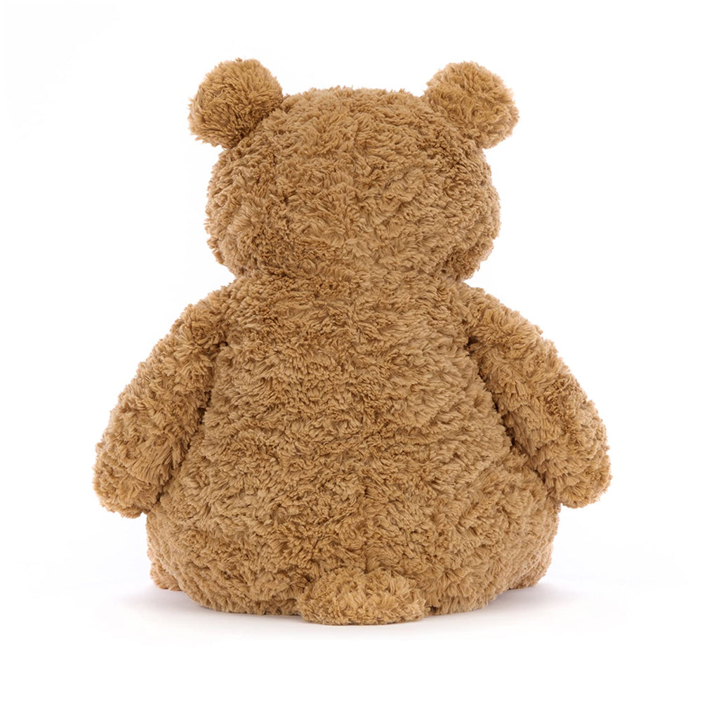Jellycat Bartholomew comparado con una mano para mostrar tamaño práctico