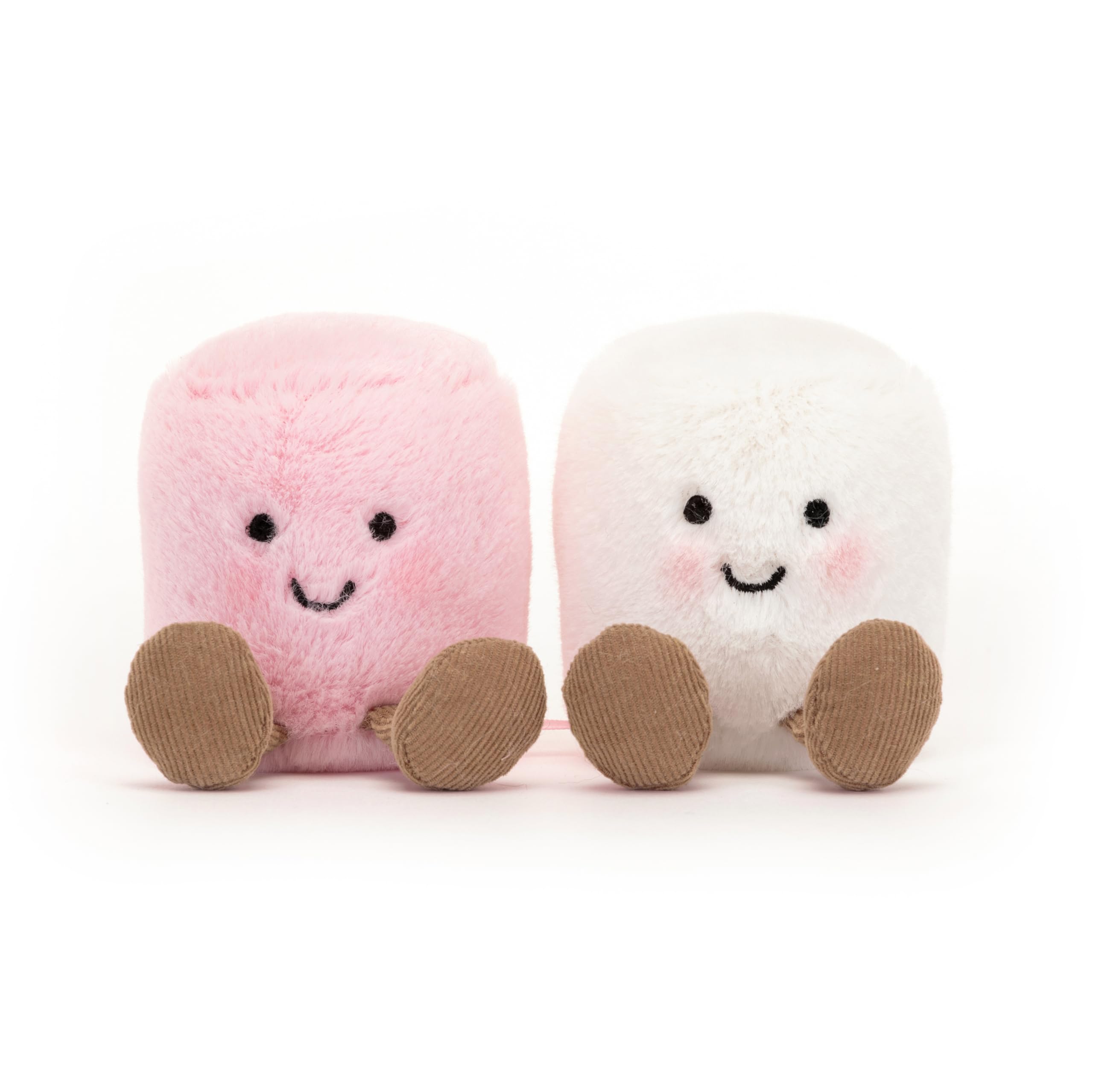 Jellycat malvaviscos colocados en una cuna como detalle decorativo y acogedor