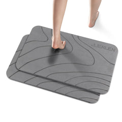 JUERLEN esterilla vista frontal con diseño ondulado gris y aspecto piedra, absorción rápida