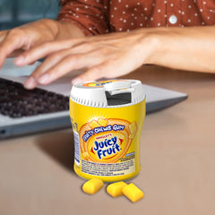 Juicy Fruit piece mid-bite showing crunchy texture and satisfying chew