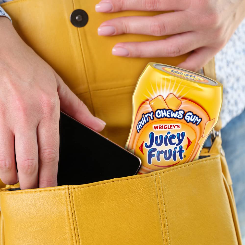 People sharing Juicy Fruit at a party with smiles and easy access